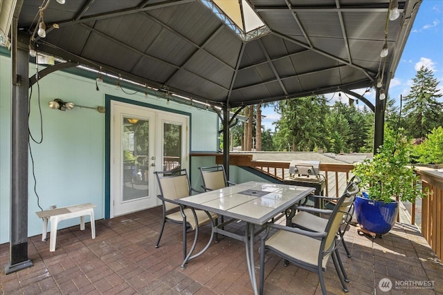 14416 4th Ave E, Tacoma, WA 98445 - view of patio / terrace featuring outdoor dining space and french doors