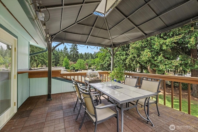 14416 4th Ave E, Tacoma, WA 98445 - wooden deck featuring outdoor dining area and a gazebo
