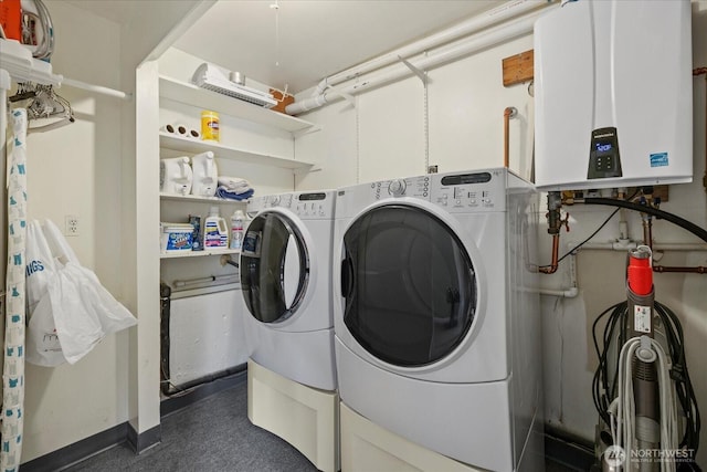14416 4th Ave E, Tacoma, WA 98445 - washroom with tankless water heater and washing machine and clothes dryer