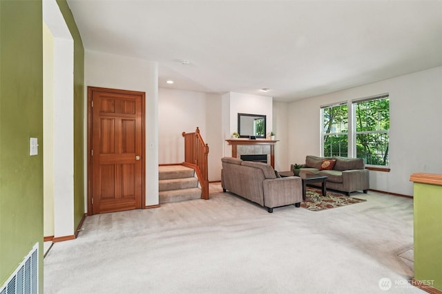 22727 NE 4th Pl Unit 117, Sammamish, WA 98074 - carpeted living room featuring stairs, a tile fireplace, and recessed lighting