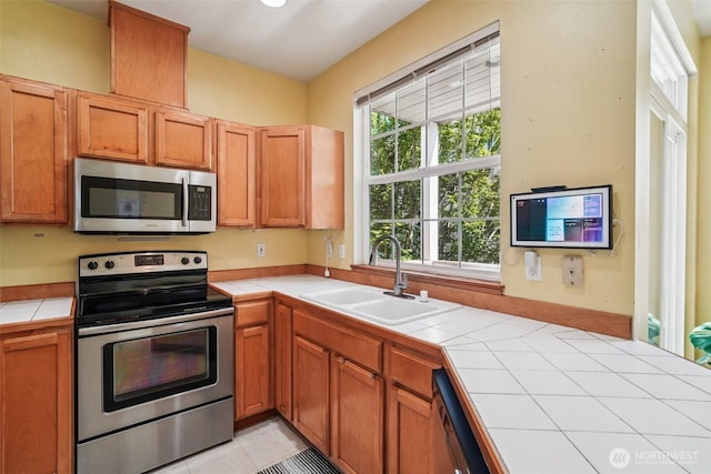 22727 NE 4th Pl Unit 117, Sammamish, WA 98074 - kitchen featuring appliances with stainless steel finishes and tile countertops