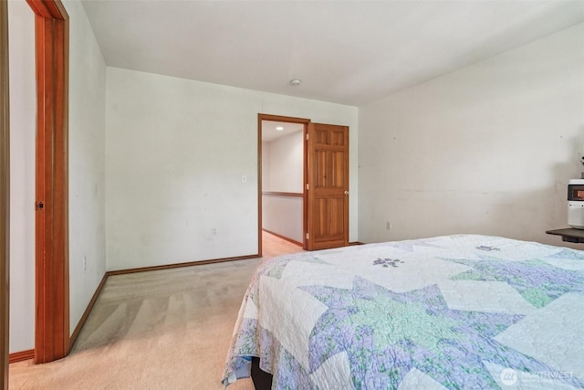 22727 NE 4th Pl Unit 117, Sammamish, WA 98074 - bedroom with light carpet and baseboards