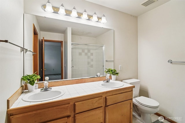 22727 NE 4th Pl Unit 117, Sammamish, WA 98074 - full bathroom with a shower stall, double vanity, and tile patterned floors