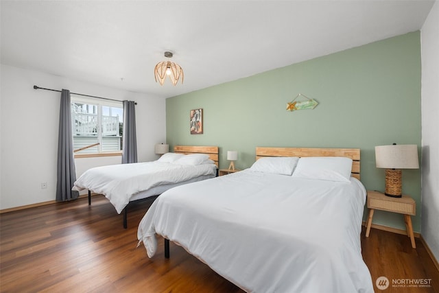 853 Ocean Shores Blvd NW Unit 4, Ocean Shores, WA 98569 - bedroom with wood finished floors and baseboards