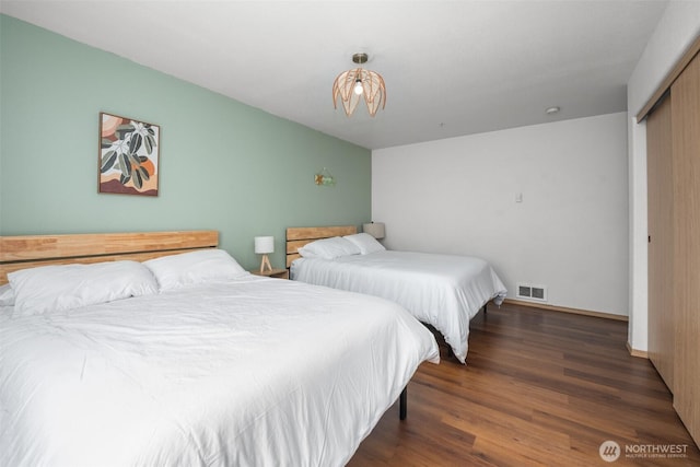853 Ocean Shores Blvd NW Unit 4, Ocean Shores, WA 98569 - bedroom with wood finished floors and a closet