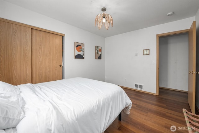 853 Ocean Shores Blvd NW Unit 4, Ocean Shores, WA 98569 - bedroom featuring dark wood-type flooring and baseboards
