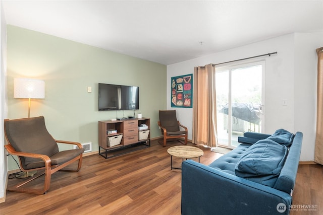 853 Ocean Shores Blvd NW Unit 4, Ocean Shores, WA 98569 - living room featuring wood finished floors and baseboards