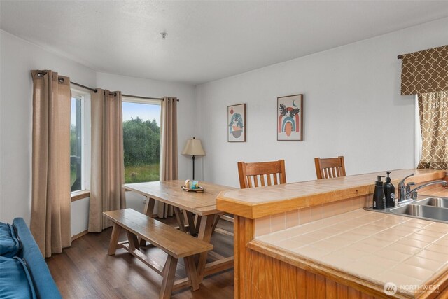 853 Ocean Shores Blvd NW Unit 4, Ocean Shores, WA 98569 - dining area with wood finished floors