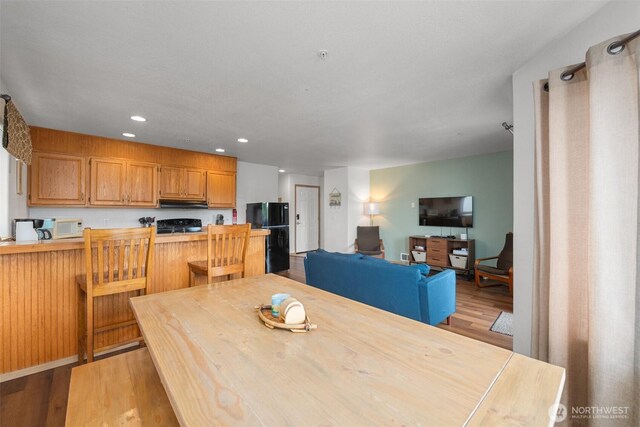 853 Ocean Shores Blvd NW Unit 4, Ocean Shores, WA 98569 - dining room with light wood finished floors and recessed lighting