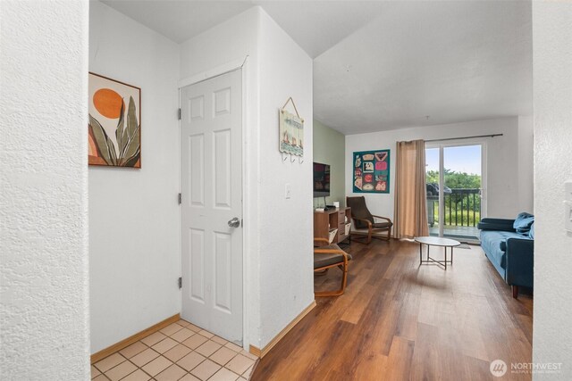 853 Ocean Shores Blvd NW Unit 4, Ocean Shores, WA 98569 - hall featuring wood finished floors and baseboards