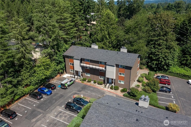230 SW Clark St Unit C203, Issaquah, WA 98207 - aerial view of property and surrounding area with a heavily wooded area