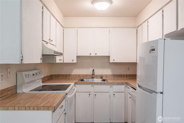 230 SW Clark St Unit C203, Issaquah, WA 98207 - kitchen featuring white appliances, under cabinet range hood, light countertops, and white cabinetry