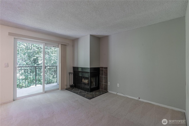 230 SW Clark St Unit C203, Issaquah, WA 98207 - unfurnished living room with carpet, a fireplace, and a textured ceiling