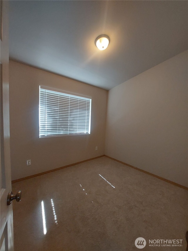 6907 Rainier Dr E Unit 1B, Everett, WA 98203 - carpeted spare room featuring baseboards