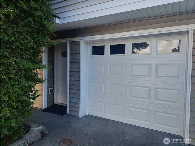 6907 Rainier Dr E Unit 1B, Everett, WA 98203 - garage with asphalt driveway