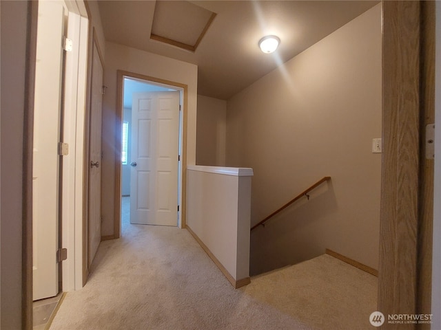 6907 Rainier Dr E Unit 1B, Everett, WA 98203 - hall featuring an upstairs landing and light colored carpet