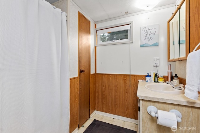 22517 133rd Street Ct E, Orting, WA 98360 - bathroom with vanity, wood walls, wainscoting, and a shower with shower curtain