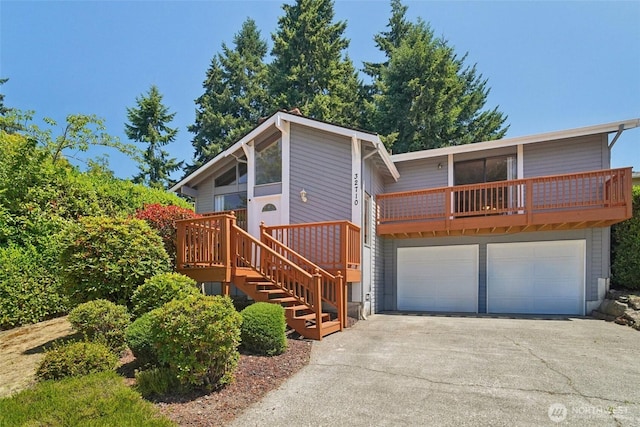 32710 5th Ave SW, Federal Way, WA 98023 - view of front of property with a garage, asphalt driveway, and stairway