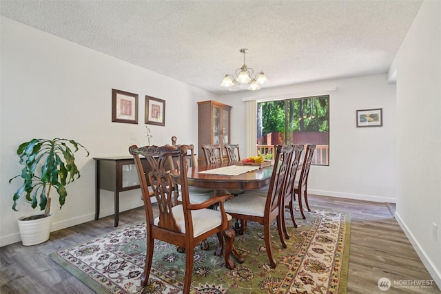 32710 5th Ave SW, Federal Way, WA 98023 - dining area with a chandelier, a textured ceiling, and wood finished floors