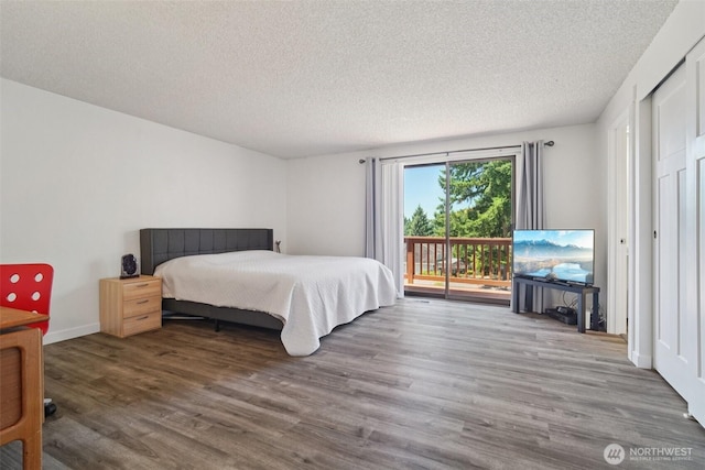 32710 5th Ave SW, Federal Way, WA 98023 - bedroom featuring access to exterior, wood finished floors, and a textured ceiling