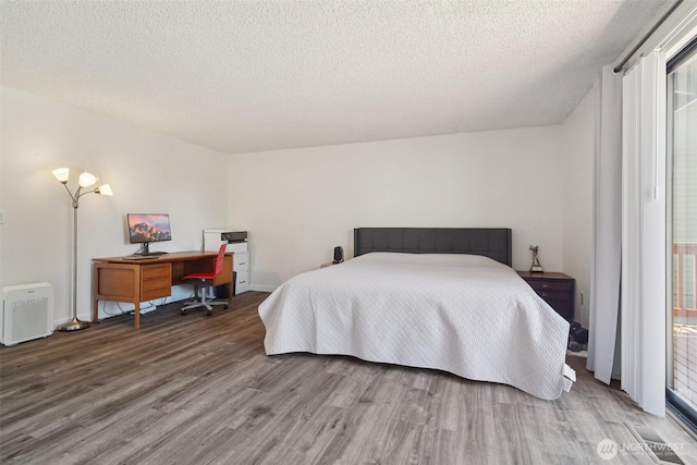 32710 5th Ave SW, Federal Way, WA 98023 - bedroom featuring wood finished floors and a textured ceiling