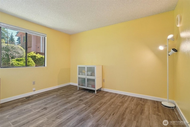 32710 5th Ave SW, Federal Way, WA 98023 - unfurnished room featuring wood finished floors and a textured ceiling