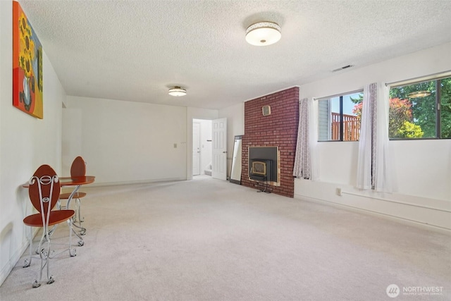 32710 5th Ave SW, Federal Way, WA 98023 - unfurnished living room featuring a textured ceiling and carpet flooring