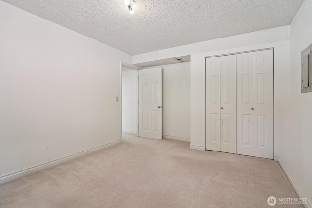 32710 5th Ave SW, Federal Way, WA 98023 - unfurnished bedroom featuring carpet, a textured ceiling, and a closet