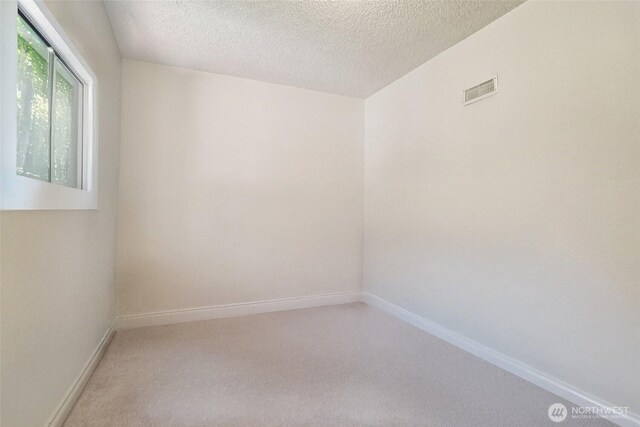 32710 5th Ave SW, Federal Way, WA 98023 - unfurnished room with a textured ceiling and light colored carpet