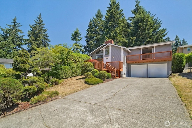 32710 5th Ave SW, Federal Way, WA 98023 - mid-century home featuring a garage, driveway, a chimney, and stairway