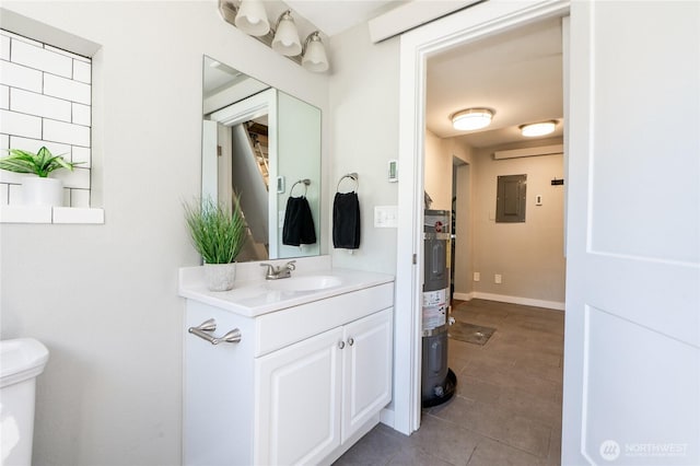462 G St, Blaine, WA 98230 - bathroom with electric panel, vanity, water heater, and tile patterned flooring