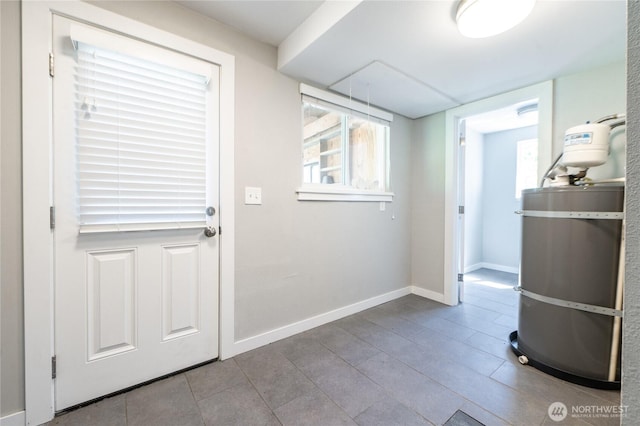 462 G St, Blaine, WA 98230 - doorway featuring secured water heater, tile patterned flooring, and healthy amount of natural light
