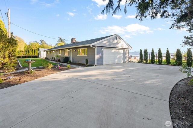 3161 Locust Ave, Bellingham, WA 98225 - single story home featuring driveway, a garage, and a chimney