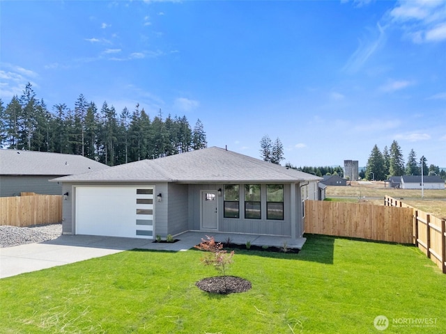 253 Kakela Rd, Winlock, WA 98596 - view of front of property featuring concrete driveway, an attached garage, and board and batten siding