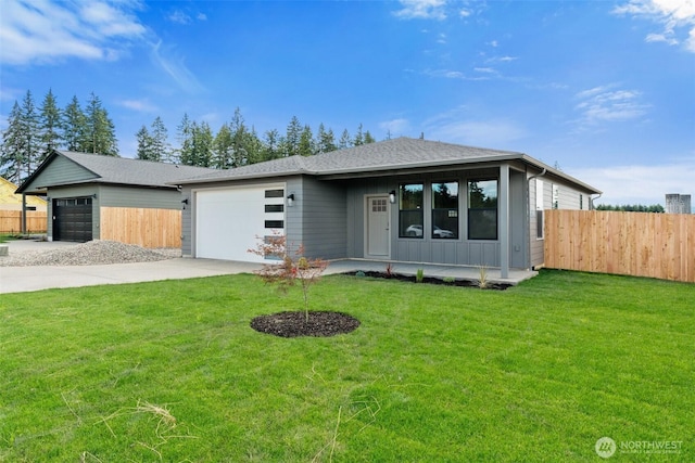 253 Kakela Rd, Winlock, WA 98596 - view of front of home featuring concrete driveway, an attached garage, board and batten siding, and a shingled roof