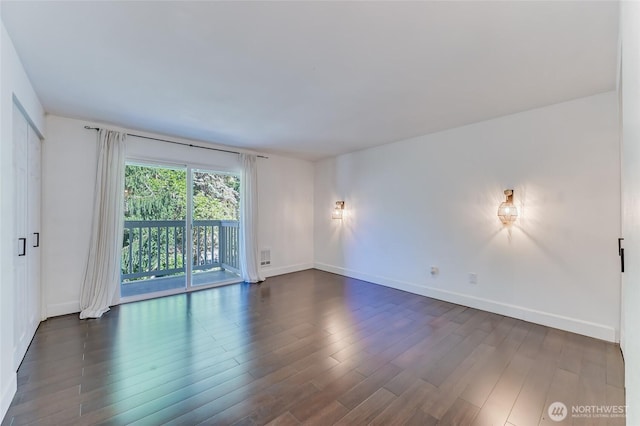 1717 150th Ave SE Unit 18, Bellevue, WA 98007 - spare room featuring dark wood-style floors and baseboards