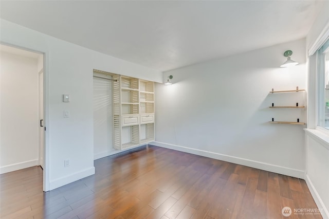 1717 150th Ave SE Unit 18, Bellevue, WA 98007 - spare room with wood finished floors and baseboards