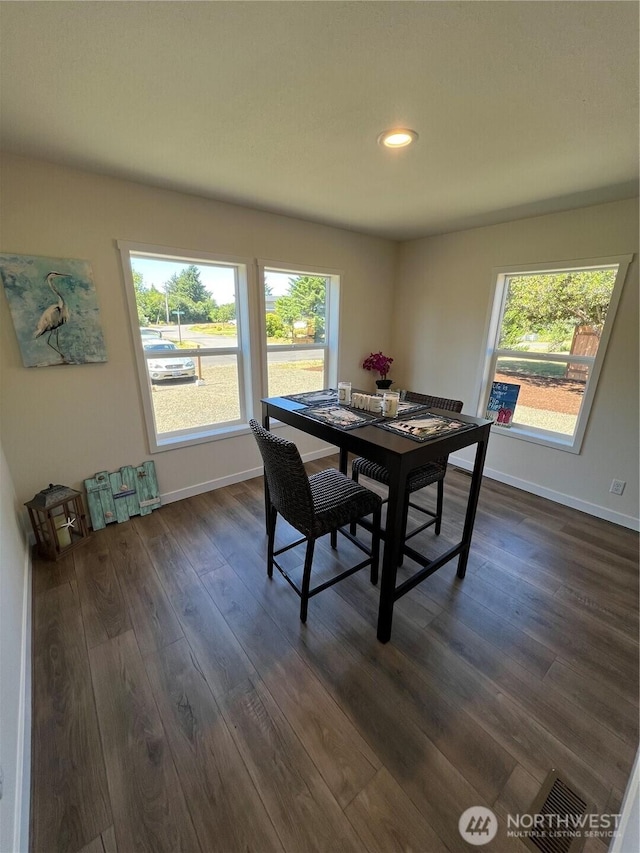 303 N Wynoochee Dr SW, Ocean Shores, WA 98569 - dining room with dark wood finished floors, plenty of natural light, and recessed lighting