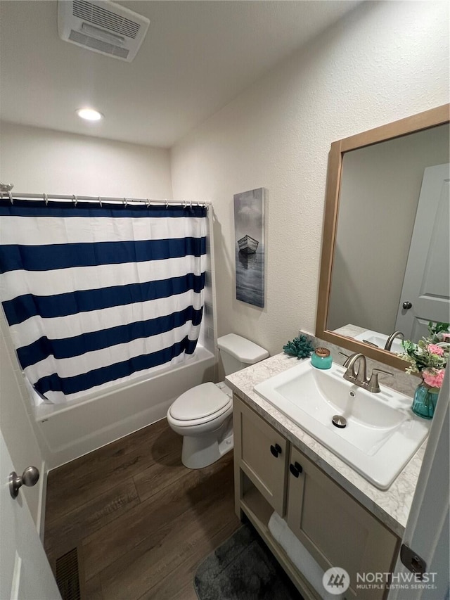 303 N Wynoochee Dr SW, Ocean Shores, WA 98569 - full bathroom featuring wood finished floors, vanity, and shower / bath combo