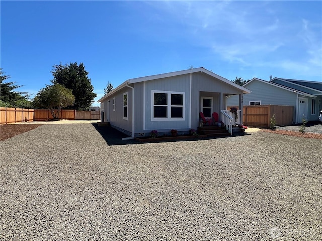 303 N Wynoochee Dr SW, Ocean Shores, WA 98569 - view of front facade with a fenced backyard