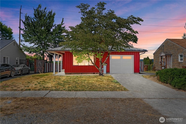 2235 E Wright Ave, Tacoma, WA 98404 - view of front of house with board and batten siding, driveway, and a garage