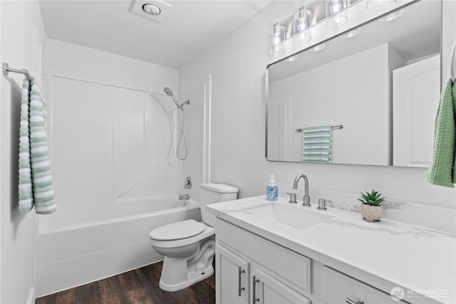 2235 E Wright Ave, Tacoma, WA 98404 - full bathroom with vanity, wood finished floors, and washtub / shower combination