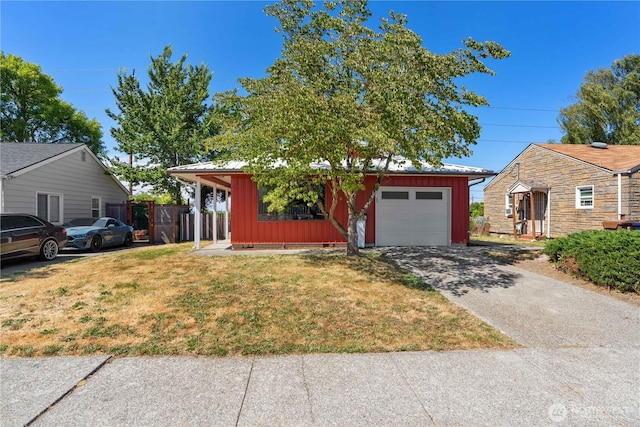 2235 E Wright Ave, Tacoma, WA 98404 - view of front facade featuring board and batten siding, driveway, and an attached garage