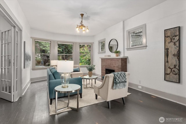 743 Broadway E, Seattle, WA 98102 - living room featuring a chandelier, hardwood / wood-style floors, and a fireplace
