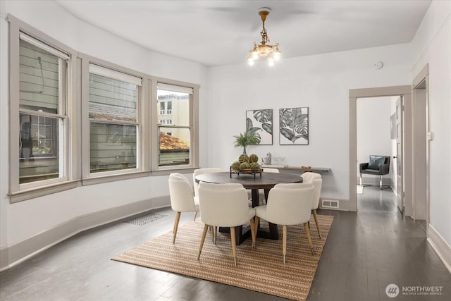 743 Broadway E, Seattle, WA 98102 - dining room with wood-type flooring and a chandelier