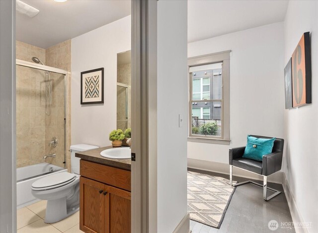 743 Broadway E, Seattle, WA 98102 - bathroom featuring vanity, shower / bath combination with glass door, and tile patterned flooring