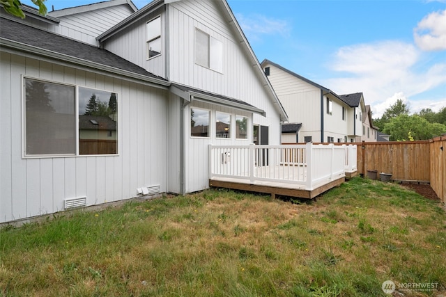 20122 102nd Ave SE, Kent, WA 98031 - rear view of property featuring a deck, a fenced backyard, and roof with shingles