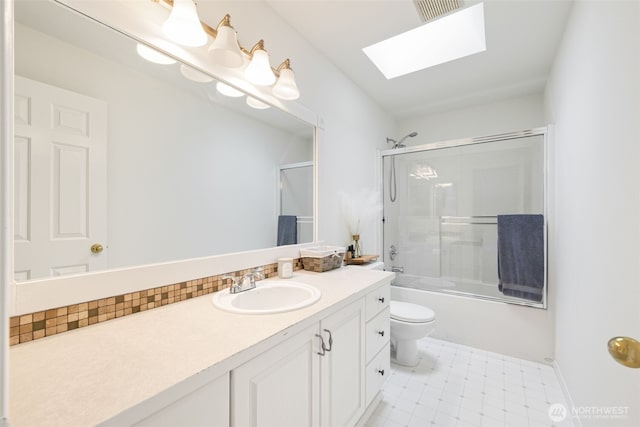 20122 102nd Ave SE, Kent, WA 98031 - full bath with a skylight, vanity, enclosed tub / shower combo, and decorative backsplash
