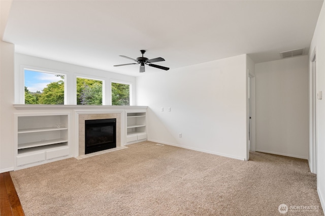 20122 102nd Ave SE, Kent, WA 98031 - unfurnished living room featuring a fireplace, ceiling fan, and carpet flooring