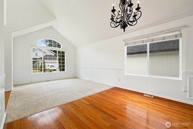 20122 102nd Ave SE, Kent, WA 98031 - empty room featuring a chandelier, hardwood / wood-style flooring, and lofted ceiling